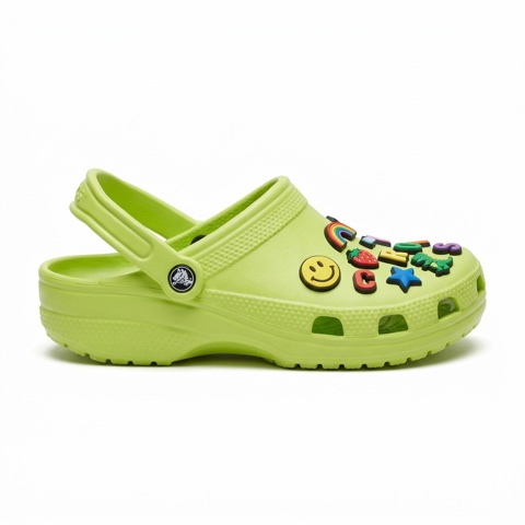 Input: product photo of a lime-green Crocs clog covered in Jibbitz charms